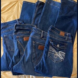 4 pair women’s jeans, 2 are Wrangler 
Wranglers retail for almost $50 each!!!